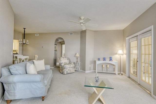 2202 Vista Cove Rd, Saint Augustine, FL 32084 - living area with arched walkways, a ceiling fan, baseboards, and carpet floors