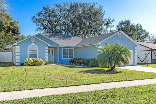 ranch-style house with a front yard and a garage