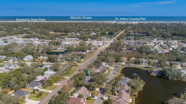 bird's eye view featuring a water view and a residential view