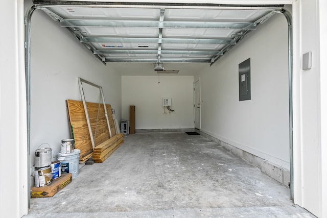 garage featuring electric panel and a garage door opener