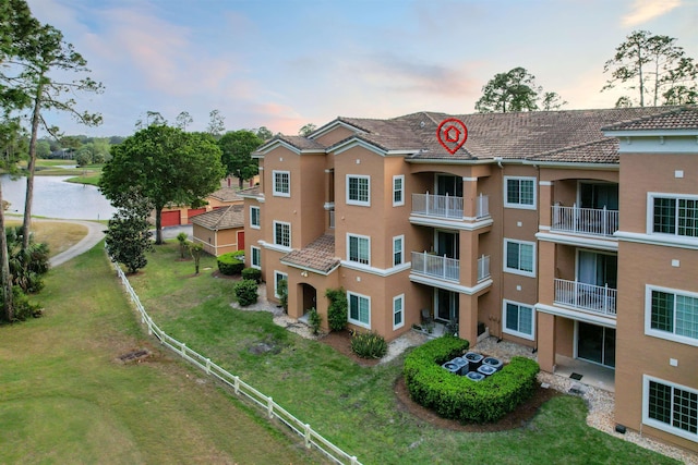 520 Florida Club Blvd Unit 310, Saint Augustine, FL 32084 - property at dusk featuring a water view and fence