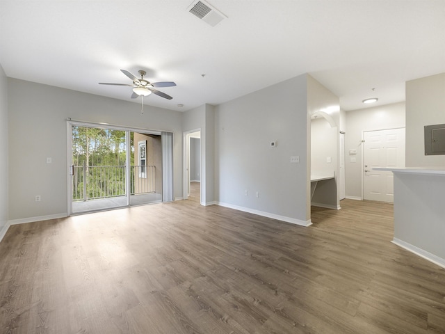 520 Florida Club Blvd Unit 310, Saint Augustine, FL 32084 - unfurnished living room featuring visible vents, baseboards, a ceiling fan, and wood finished floors