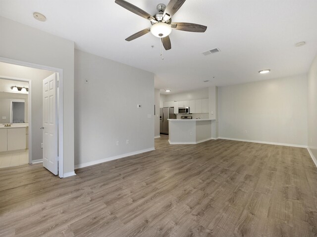 520 Florida Club Blvd Unit 310, Saint Augustine, FL 32084 - unfurnished living room with visible vents, baseboards, and a ceiling fan