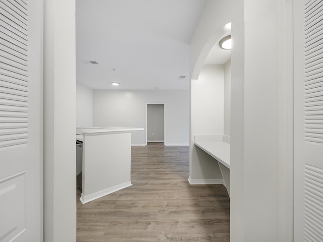 520 Florida Club Blvd Unit 310, Saint Augustine, FL 32084 - corridor with arched walkways, visible vents, baseboards, and wood finished floors