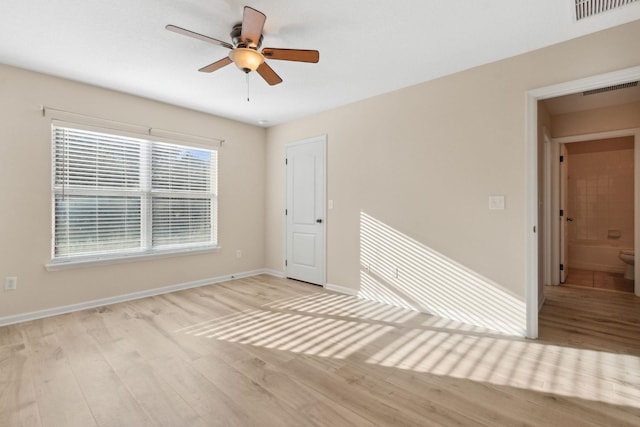 spare room with ceiling fan and light hardwood / wood-style flooring