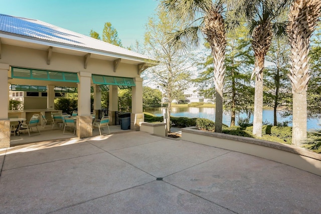 view of patio / terrace with a water view