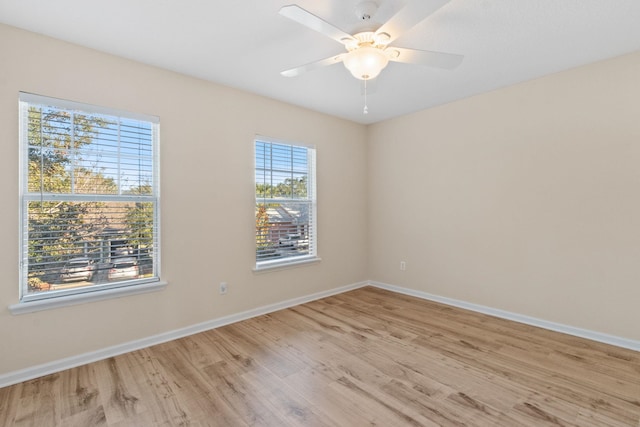 spare room featuring ceiling fan and light wood-type flooring