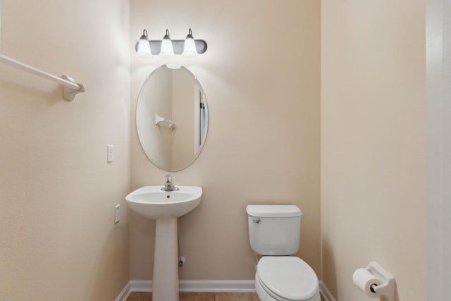 bathroom with toilet and sink