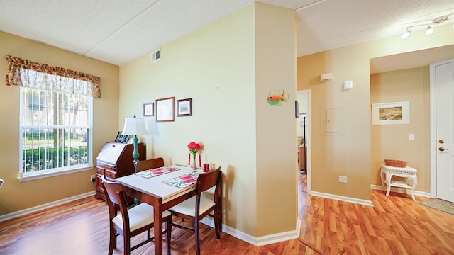 308 Augusta Cir, Saint Augustine, FL 32086 - home office with baseboards, a textured ceiling, visible vents, and wood finished floors