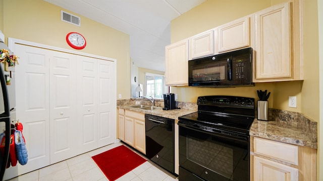 308 Augusta Cir, Saint Augustine, FL 32086 - kitchen featuring light brown cabinetry, light tile patterned flooring, a sink, visible vents, and black appliances