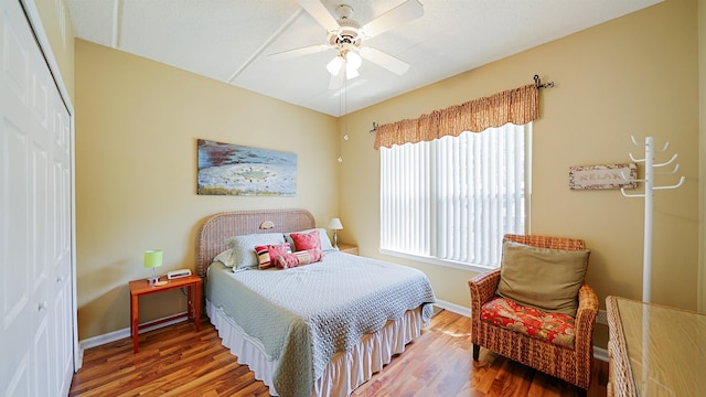 308 Augusta Cir, Saint Augustine, FL 32086 - bedroom with a ceiling fan, baseboards, wood finished floors, and a closet