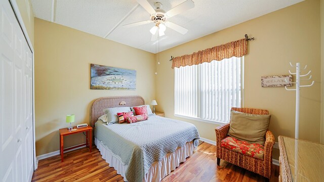 308 Augusta Cir, Saint Augustine, FL 32086 - bedroom with a ceiling fan, baseboards, wood finished floors, and a closet