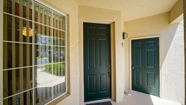 308 Augusta Cir, Saint Augustine, FL 32086 - doorway to property featuring stucco siding