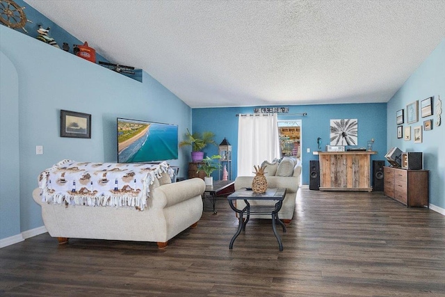 living room featuring dark hardwood / wood-style flooring, vaulted ceiling, and a textured ceiling