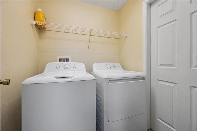 laundry area with independent washer and dryer