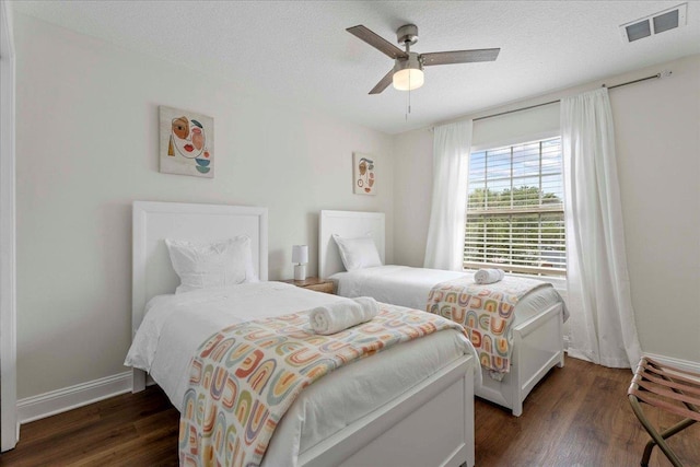 28 S Comares Ave, Saint Augustine, FL 32080 - bedroom featuring wood finished floors, baseboards, a ceiling fan, and a textured ceiling
