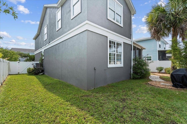28 S Comares Ave, Saint Augustine, FL 32080 - view of side of home with stucco siding and a gate