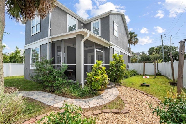 28 S Comares Ave, Saint Augustine, FL 32080 - view of side of property with stucco siding and a sunroom