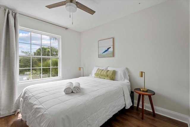 28 S Comares Ave, Saint Augustine, FL 32080 - bedroom with wood finished floors, baseboards, and a ceiling fan