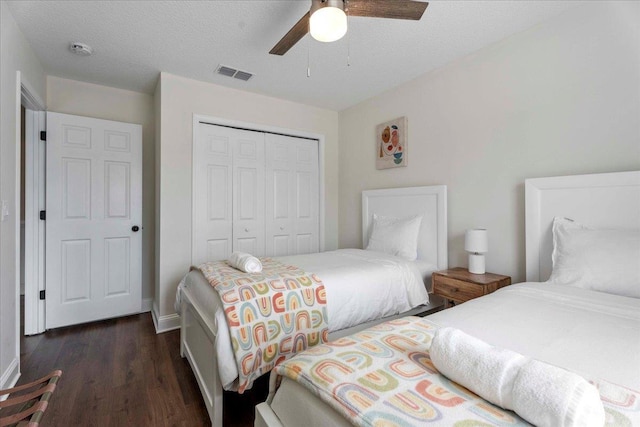 28 S Comares Ave, Saint Augustine, FL 32080 - bedroom with a closet, dark wood finished floors, baseboards, and ceiling fan