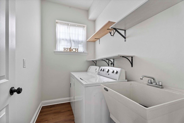 28 S Comares Ave, Saint Augustine, FL 32080 - laundry room with washing machine and dryer, wood finished floors, and baseboards