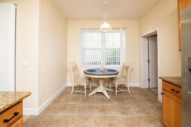 dining area with light tile patterned floors