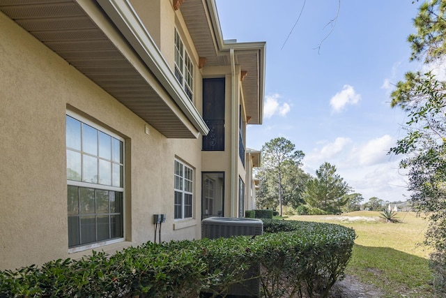 view of side of home featuring central air condition unit