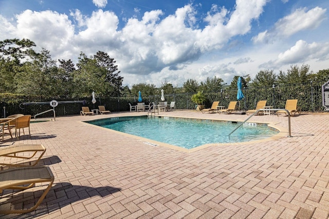 view of swimming pool with a patio area