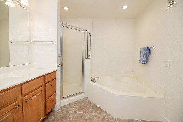 bathroom featuring vanity, separate shower and tub, and tile patterned floors