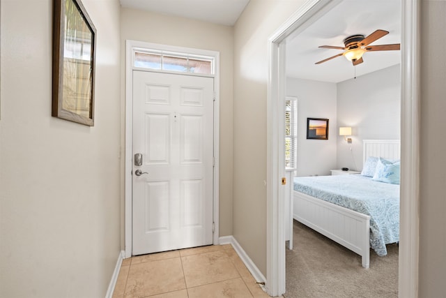 entryway featuring ceiling fan and light tile patterned floors