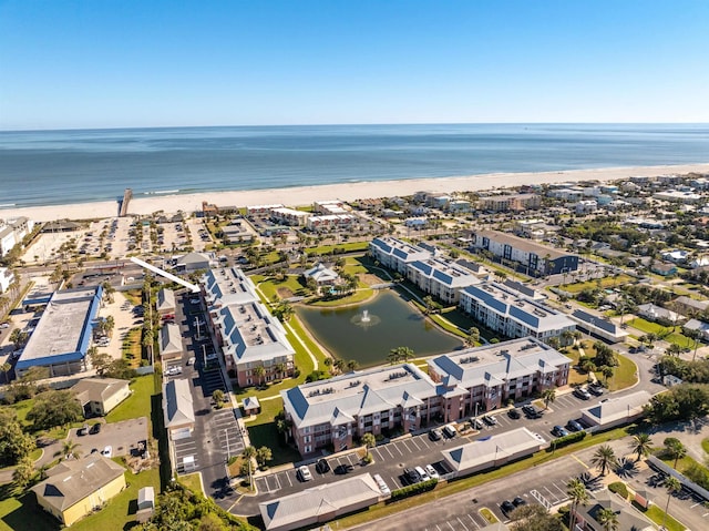 aerial view with a beach view and a water view