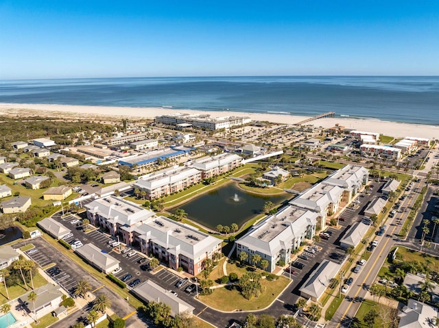 birds eye view of property featuring a water view and a view of the beach