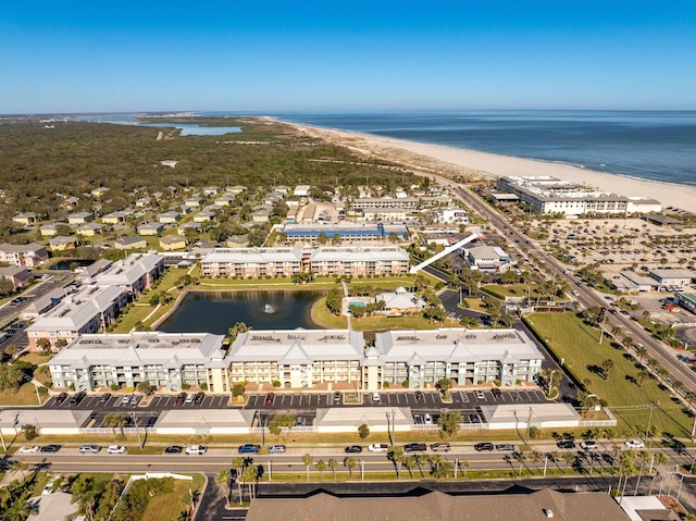 bird's eye view with a view of the beach and a water view