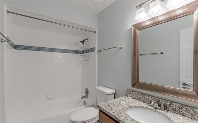 full bathroom with vanity, toilet, and tiled shower / bath combo