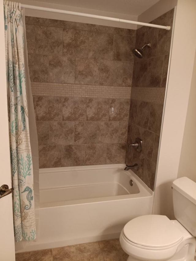 full bathroom with tile patterned floors, shower / bathtub combination with curtain, and toilet