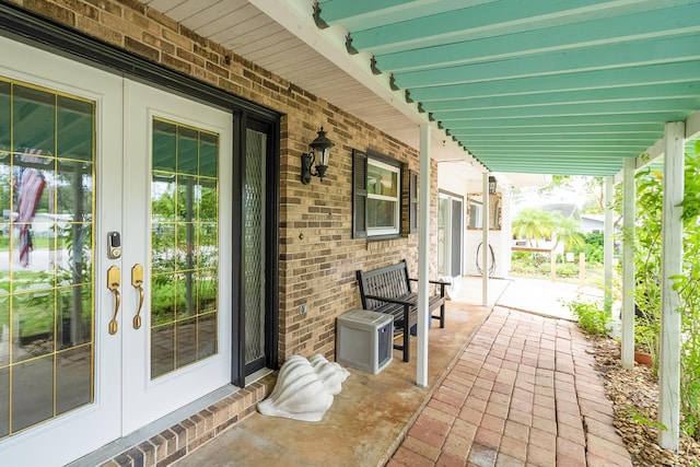 view of patio / terrace featuring covered porch and french doors