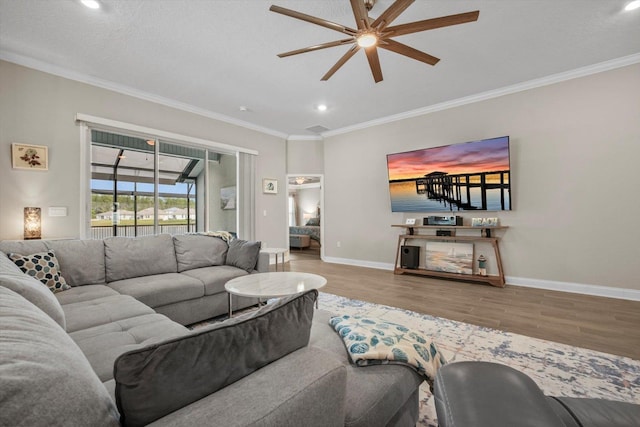 52 Lumberjack Trl, Palm Coast, FL 32137 - living room with ceiling fan, wood finished floors, crown molding, and recessed lighting