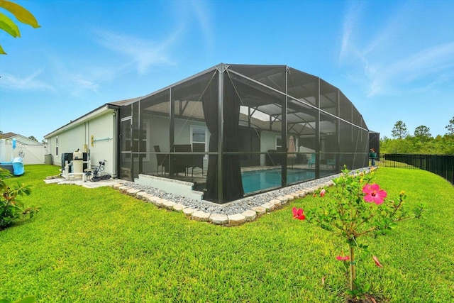 52 Lumberjack Trl, Palm Coast, FL 32137 - rear view of property featuring a fenced backyard, a lanai, and stucco siding