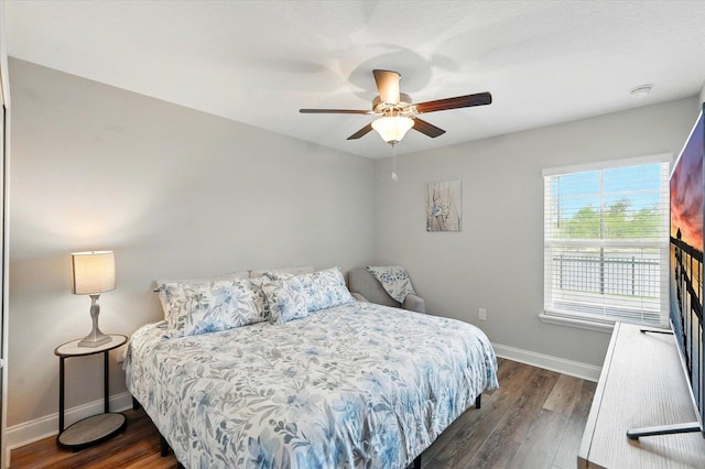52 Lumberjack Trl, Palm Coast, FL 32137 - bedroom with dark wood-style floors and a ceiling fan