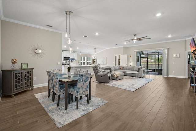 52 Lumberjack Trl, Palm Coast, FL 32137 - dining area featuring a ceiling fan, crown molding, dark wood-type flooring, and recessed lighting