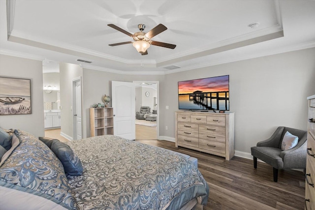 52 Lumberjack Trl, Palm Coast, FL 32137 - bedroom featuring a tray ceiling, wood finished floors, crown molding, ensuite bathroom, and ceiling fan