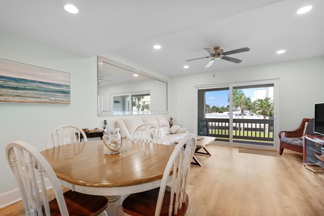 dining space with light wood-type flooring and ceiling fan