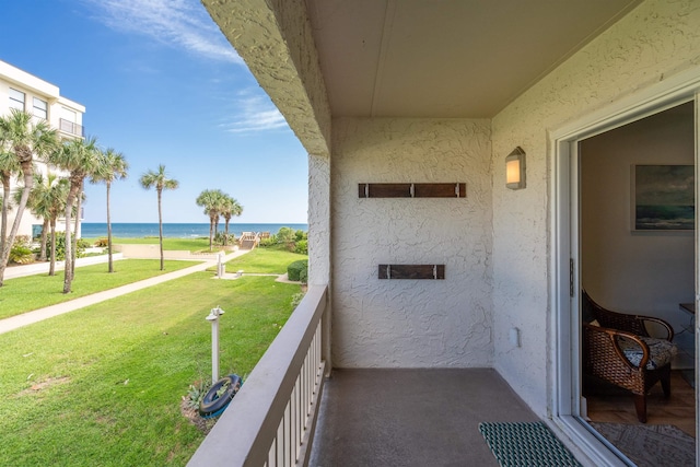 balcony featuring a water view