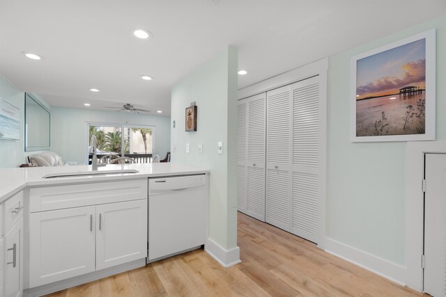 kitchen with ceiling fan, sink, dishwasher, light hardwood / wood-style flooring, and white cabinets