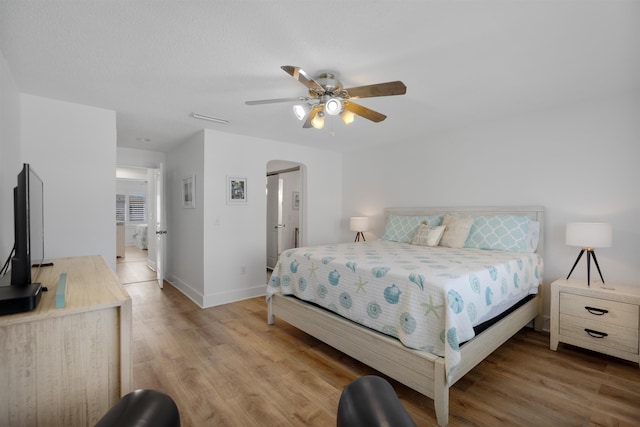 bedroom with hardwood / wood-style flooring and ceiling fan