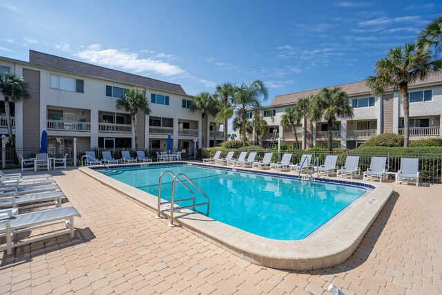 view of swimming pool with a patio area