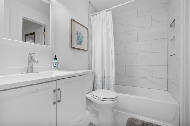 full bathroom with shower / tub combo, vanity, and toilet