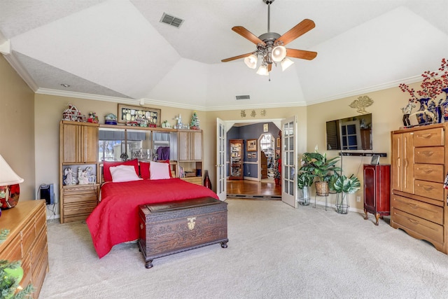 carpeted bedroom with lofted ceiling, ceiling fan, and ornamental molding