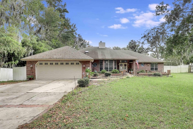 ranch-style home with a garage and a front lawn