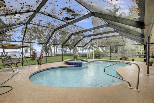 view of pool featuring an in ground hot tub, a yard, a patio, and glass enclosure